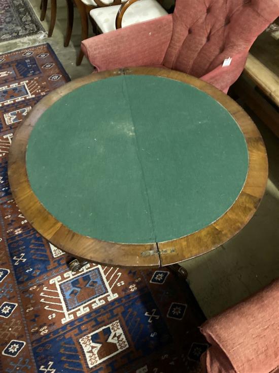A Victorian inlaid walnut demi-lune folding card table, width 90cm, depth 44cm, height 70cm